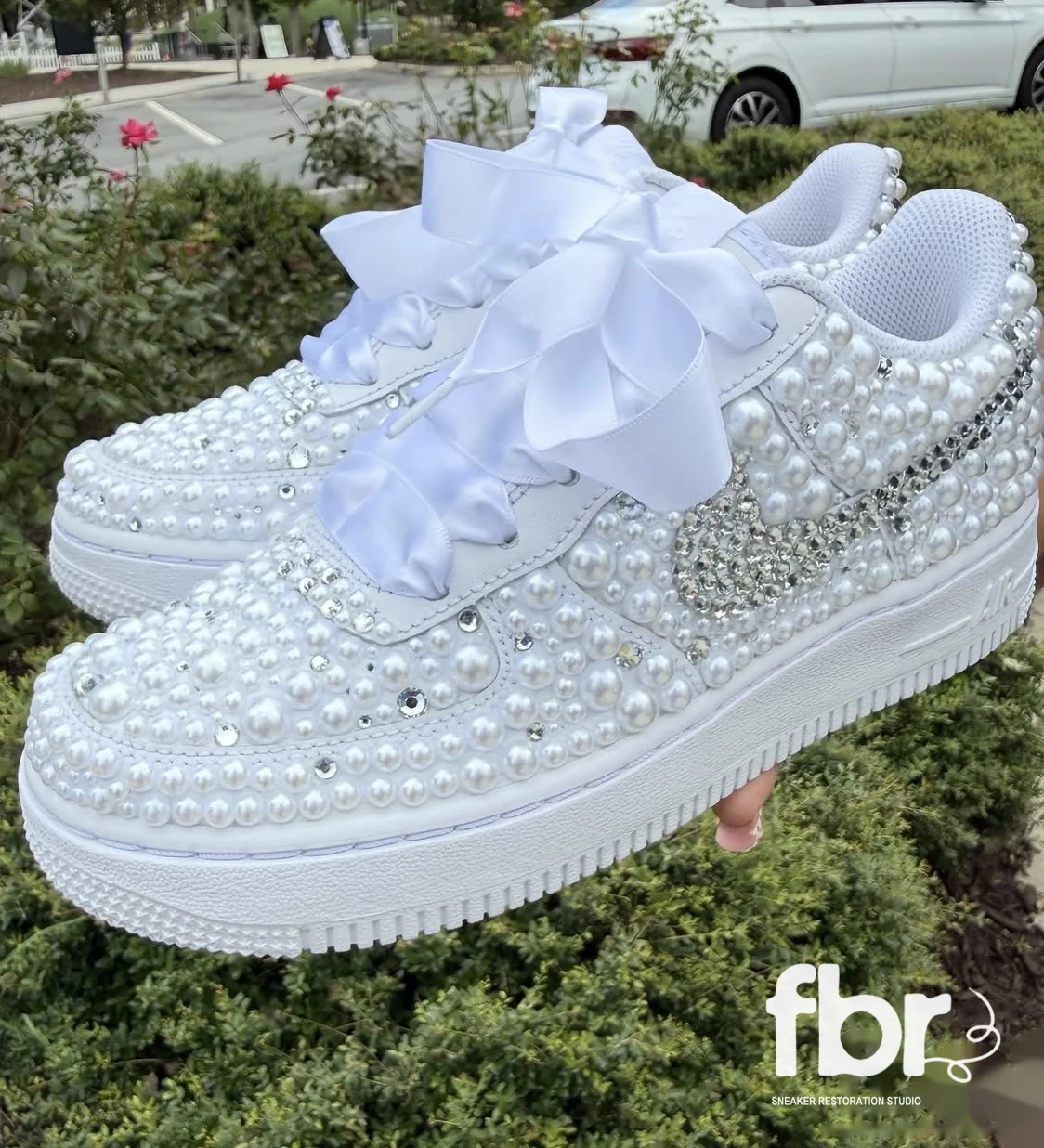 Custom Air Force 1s covered in pearls and crystals, side view